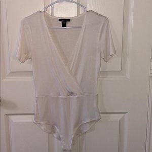 NEVER WORN. White bodysuit.